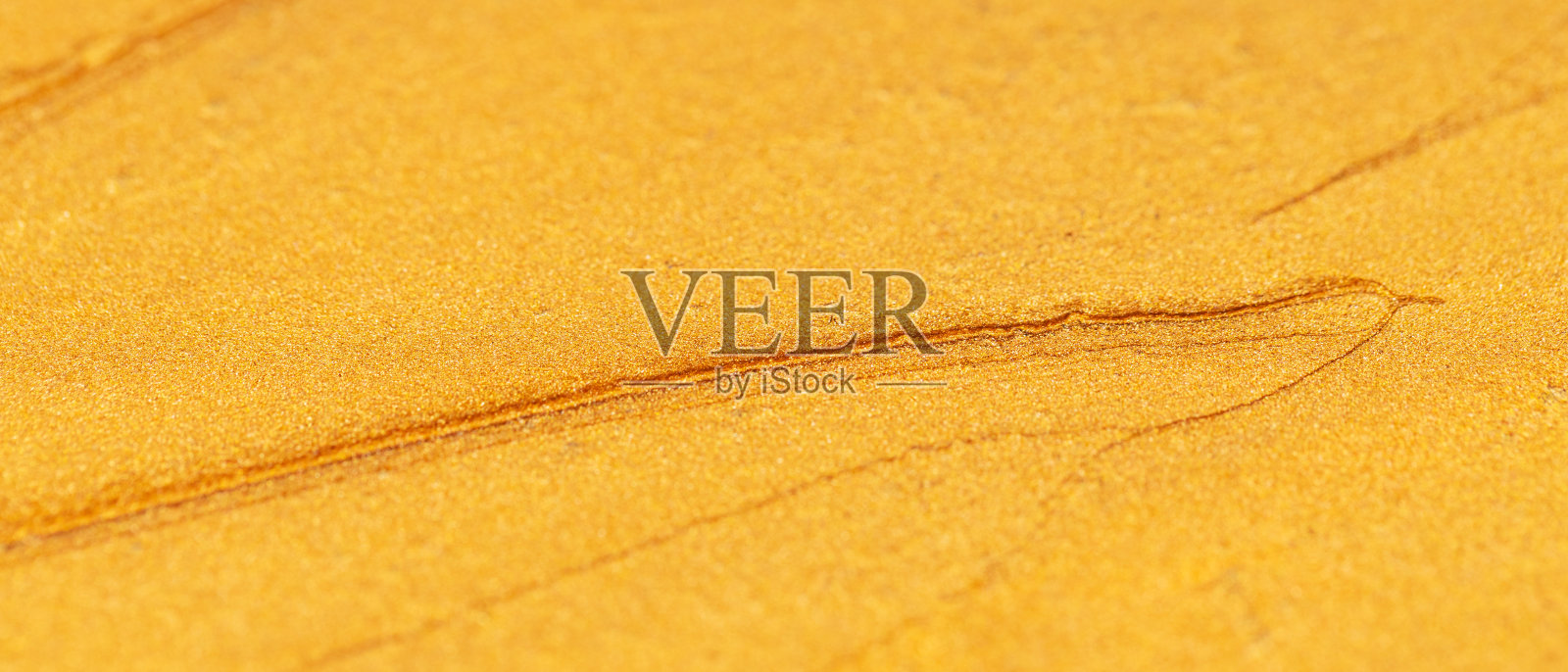 金色的抽象背景。奢华闪亮的金色质感。圣诞装饰背景。金画模式。空白的设计师。极简主义照片摄影图片