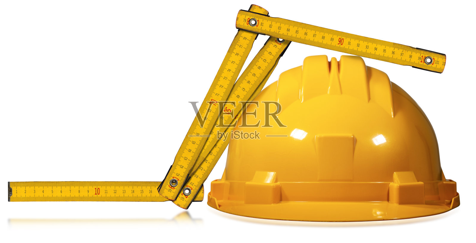 木制黄色折叠尺和橙色安全帽照片摄影图片