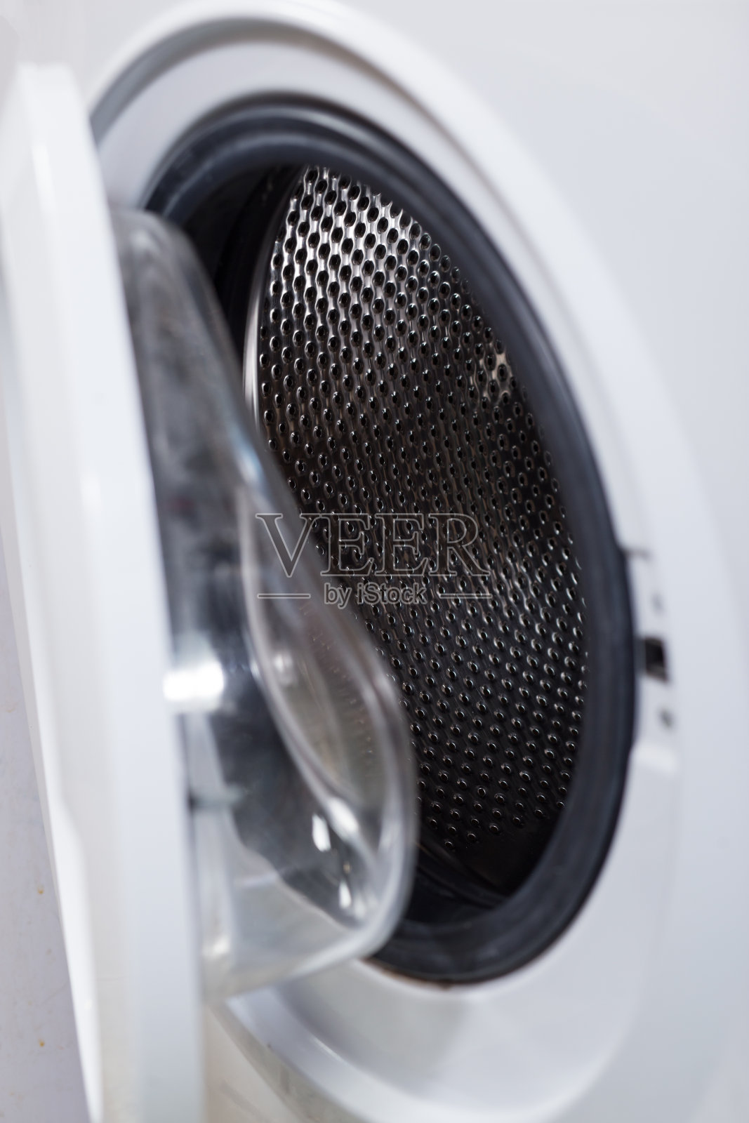 洗衣机的门。打开洗衣机照片摄影图片