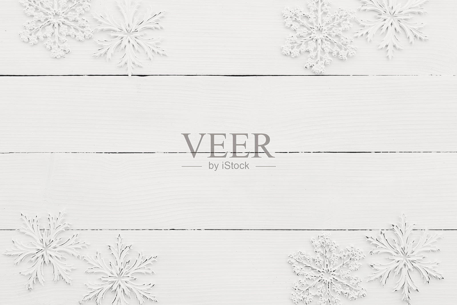 白色木质背景上的白色雪花墙纸照片摄影图片