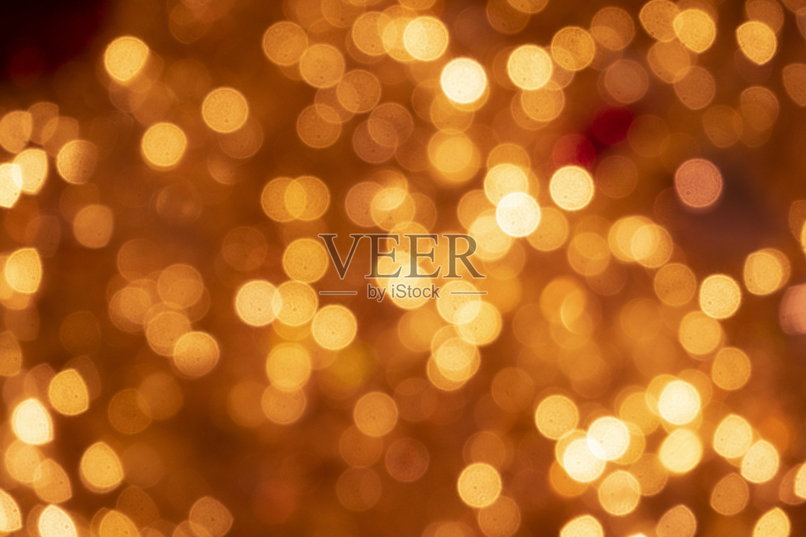 圣诞和新年彩灯。模糊的橙色灯光。可以用作背景和纹理吗照片摄影图片