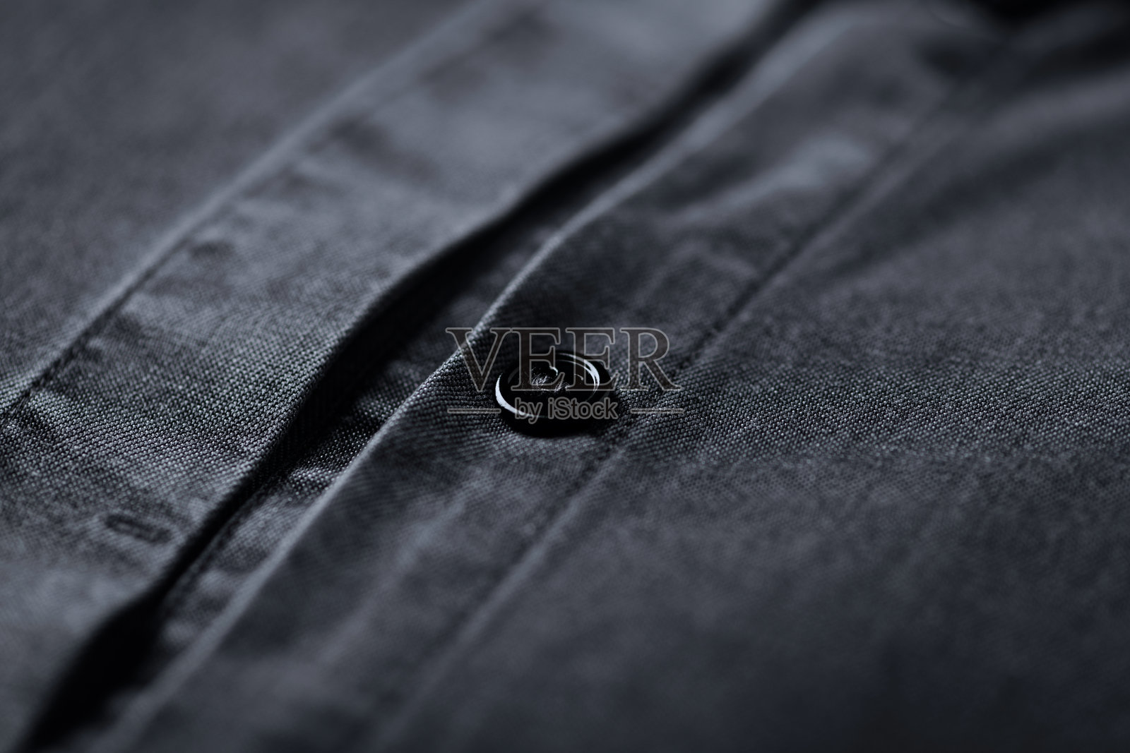 男子的天丝衬衫的近距离。照片摄影图片