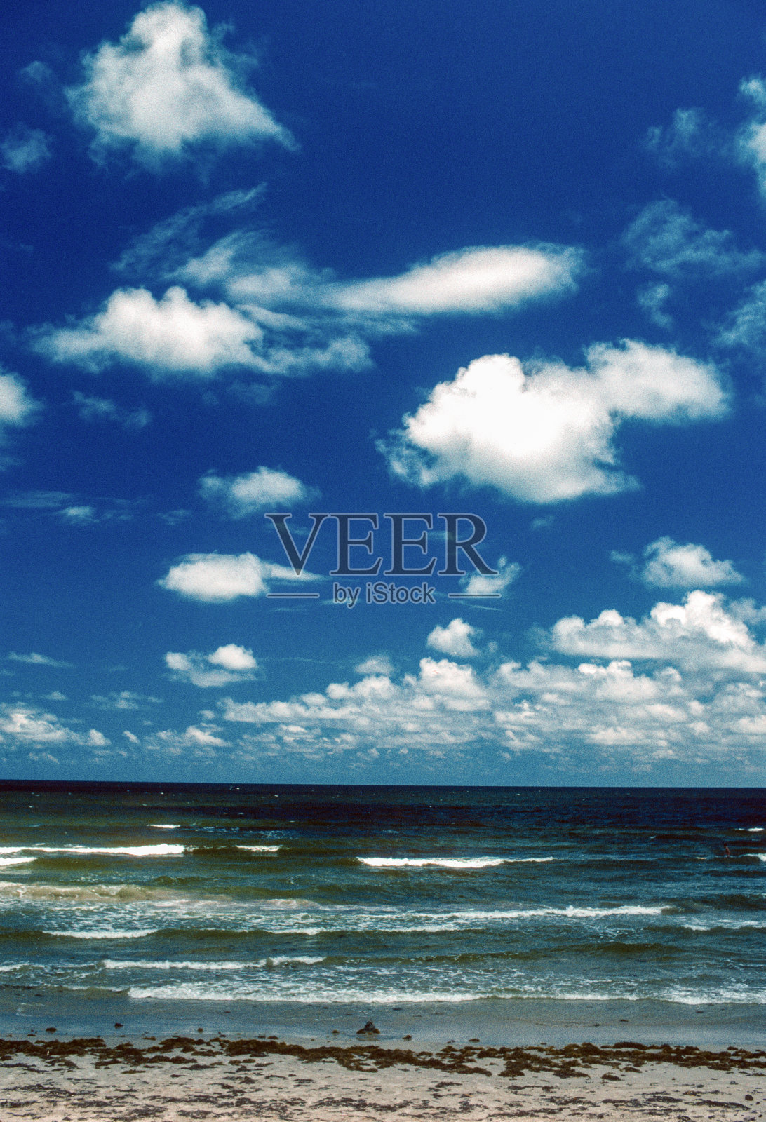 Padre岛国家海岸-冲浪和云层垂直- 2002照片摄影图片