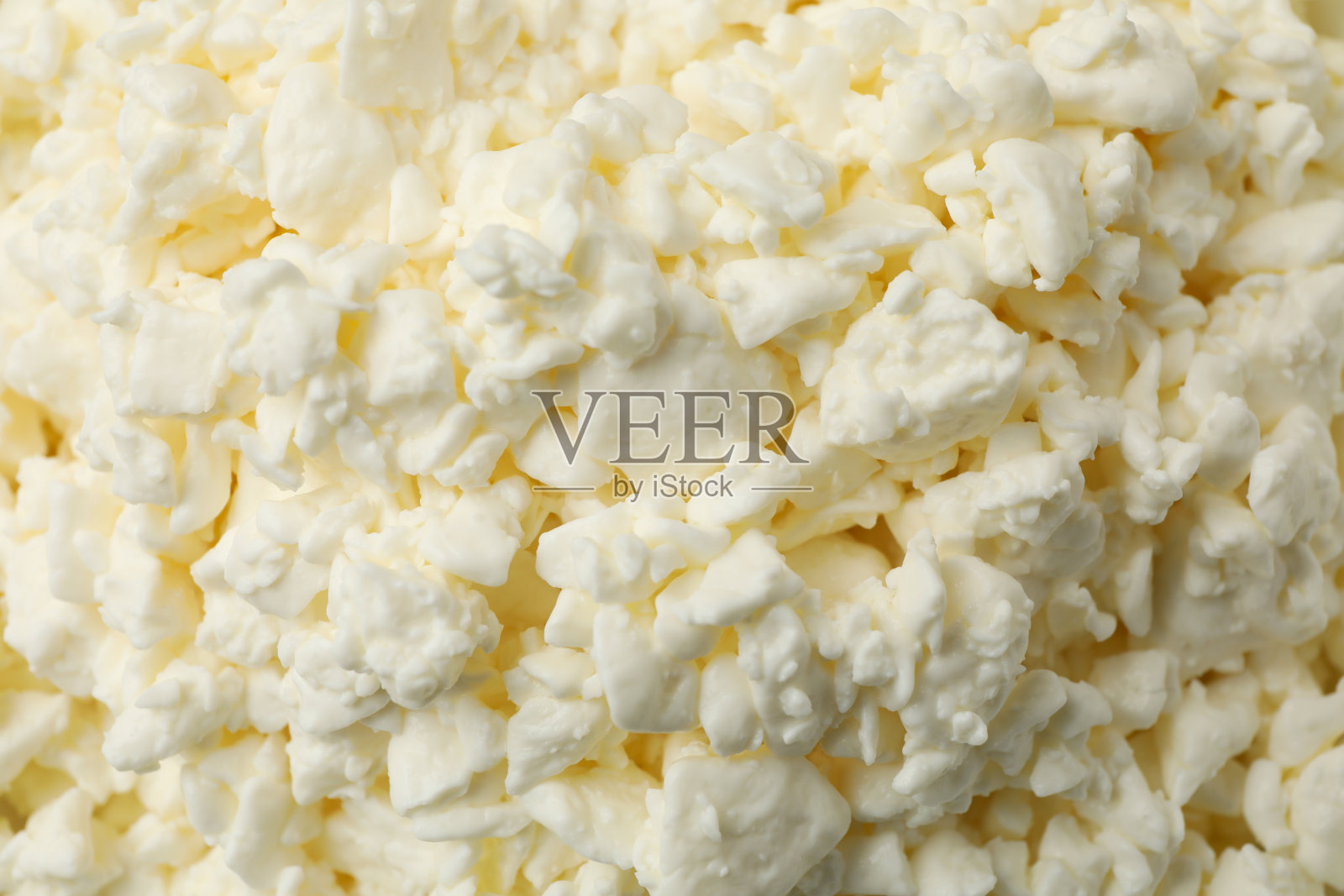 背景是新鲜的白干酪,特写照片摄影图片