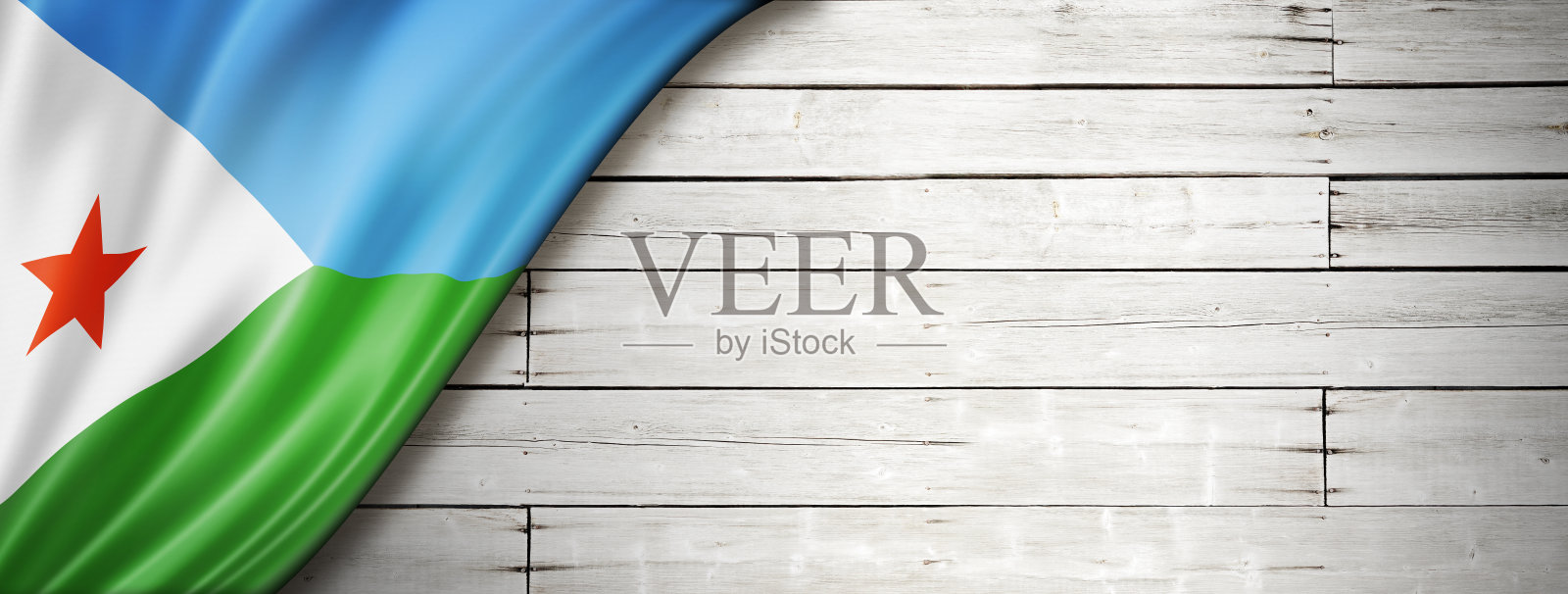 吉布提国旗上的老白墙横幅照片摄影图片