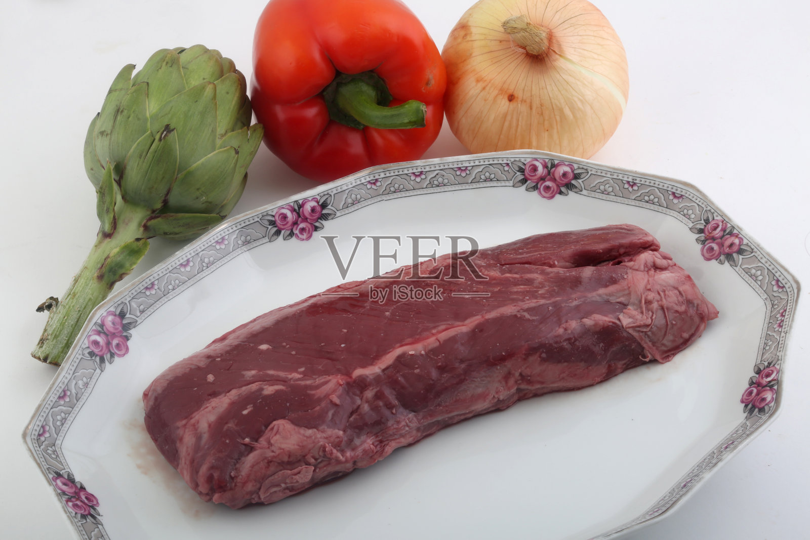 以洋蓟、红辣椒及洋葱为食照片摄影图片