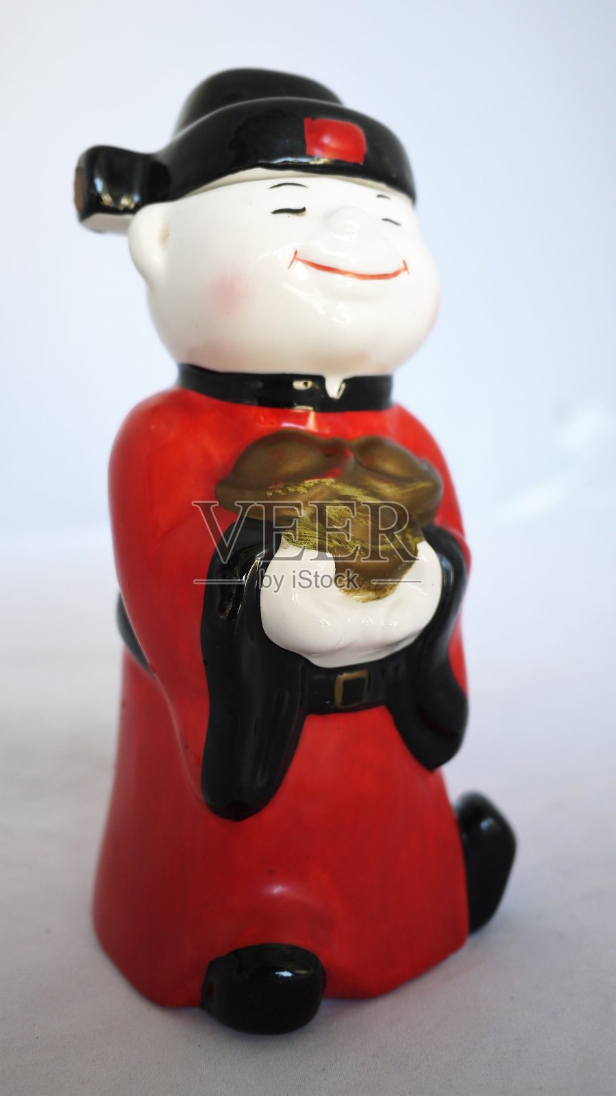 代表幸福、财富和繁荣的陶瓷仿古雕像照片摄影图片