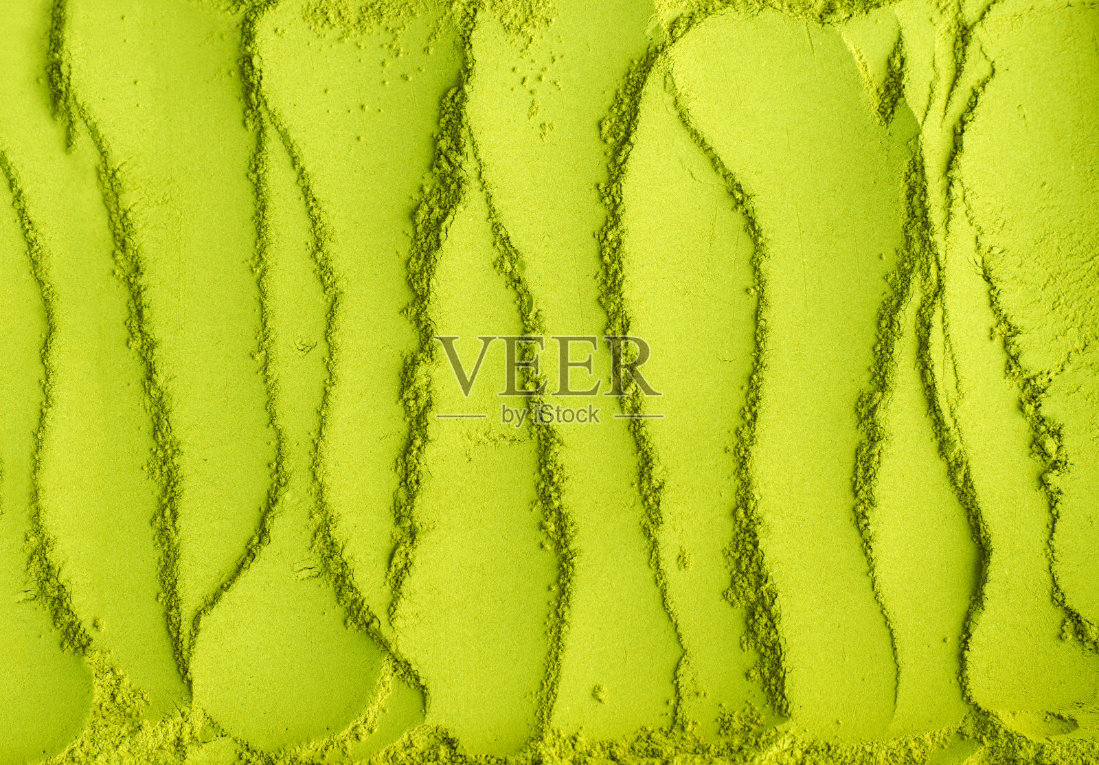 抹茶粉的背景。绿茶质地特写,选择性聚焦照片摄影图片