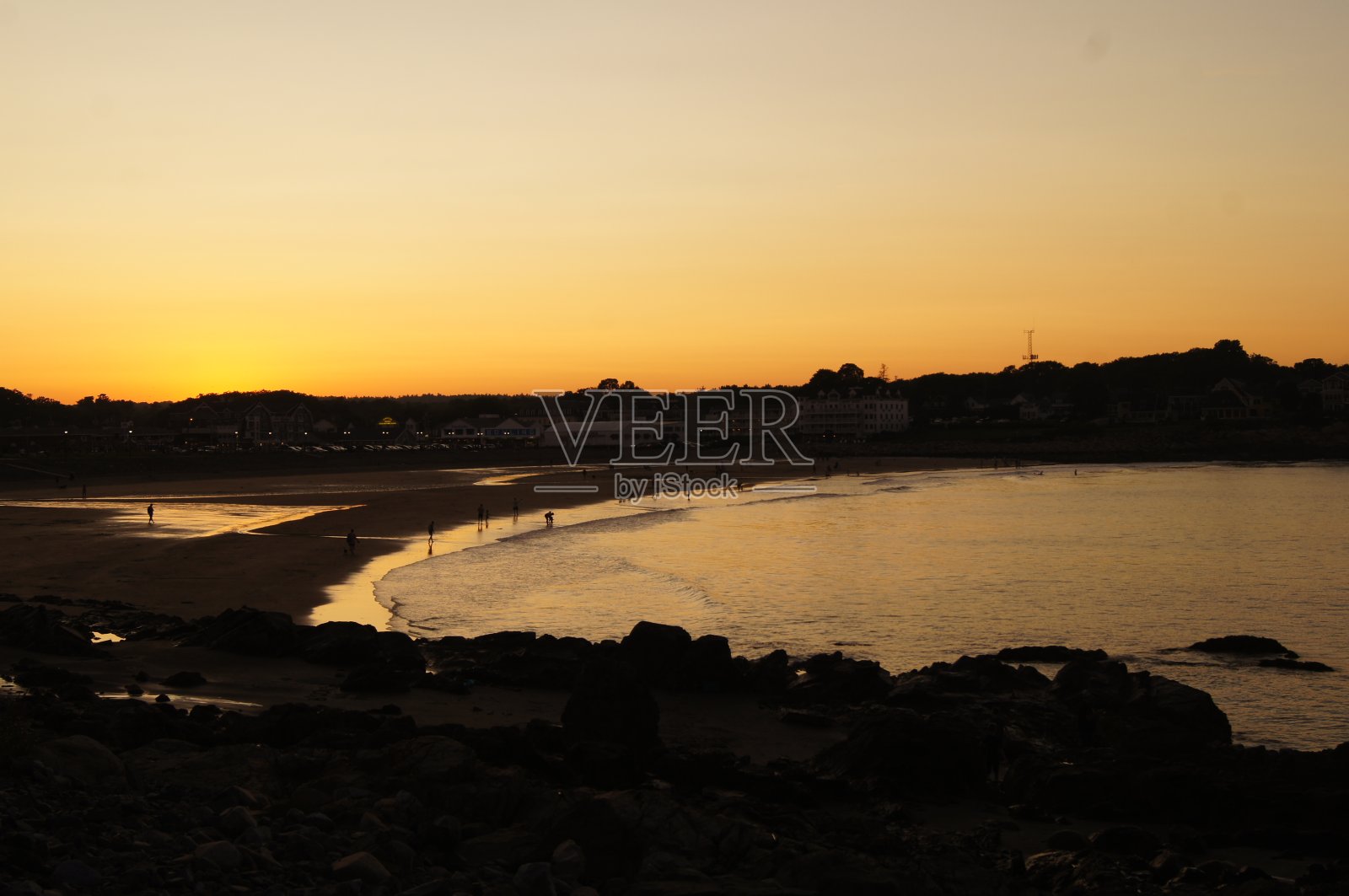 短沙海滩在约克,缅因州在日落照片摄影图片