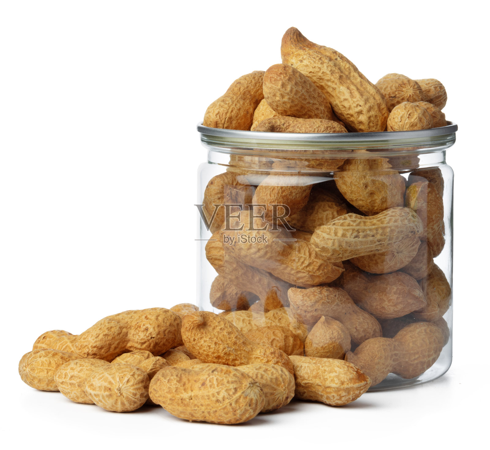 玻璃罐与花生隔离在白色照片摄影图片