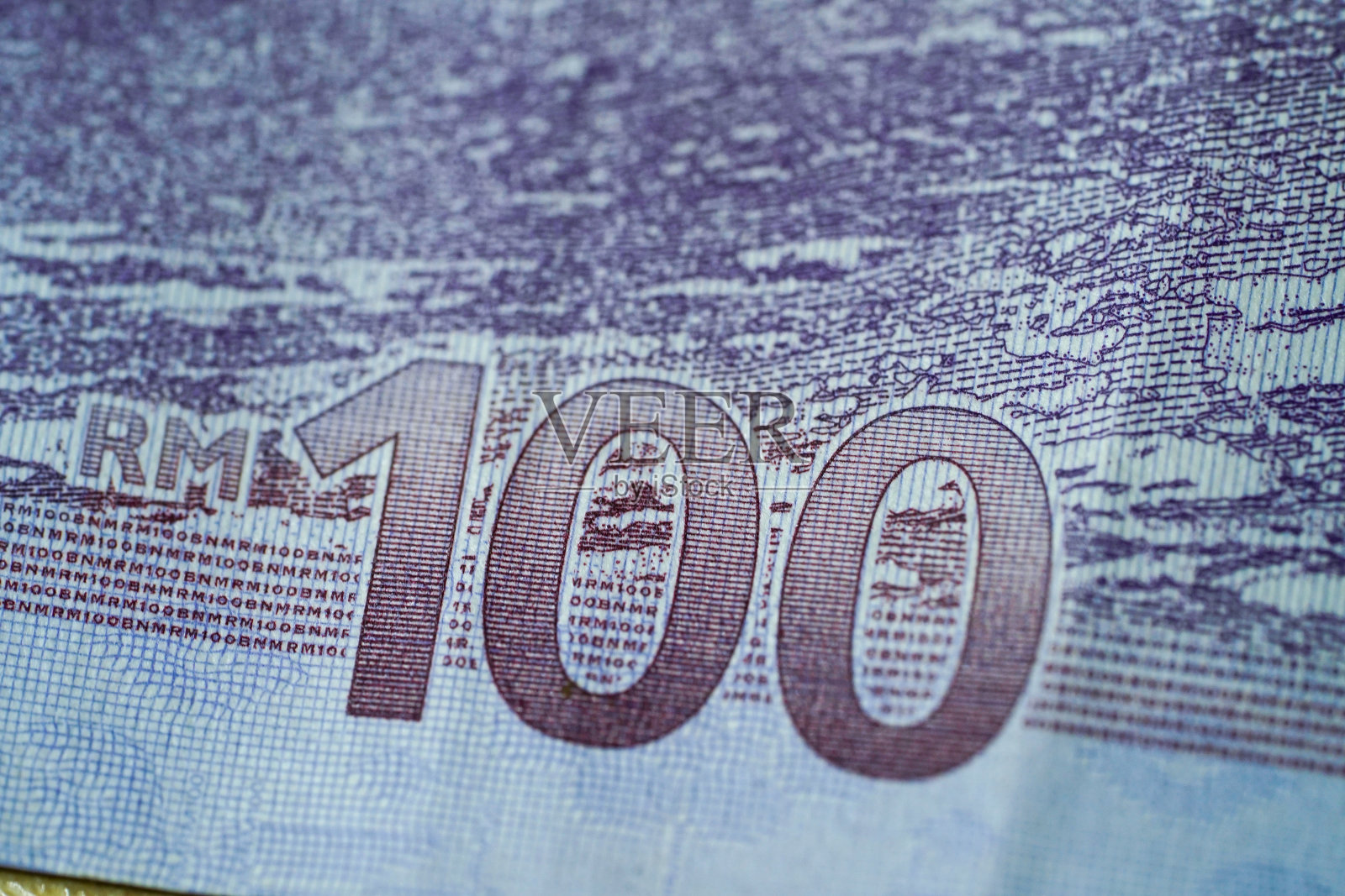 近距离拍摄的马来西亚纸币价值100林吉特照片摄影图片