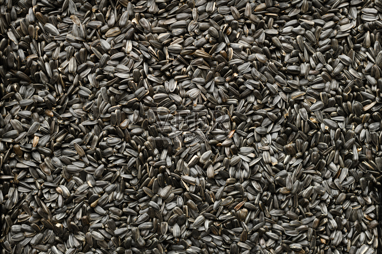 葵花籽背景,特写烤种子照片摄影图片