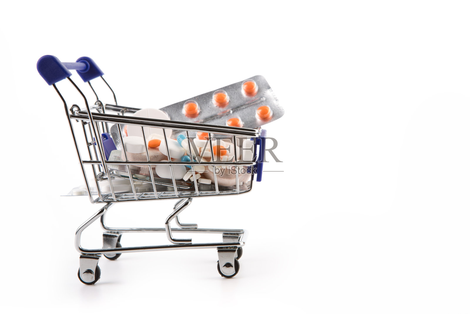 一辆装满药片和胶囊的购物车照片摄影图片