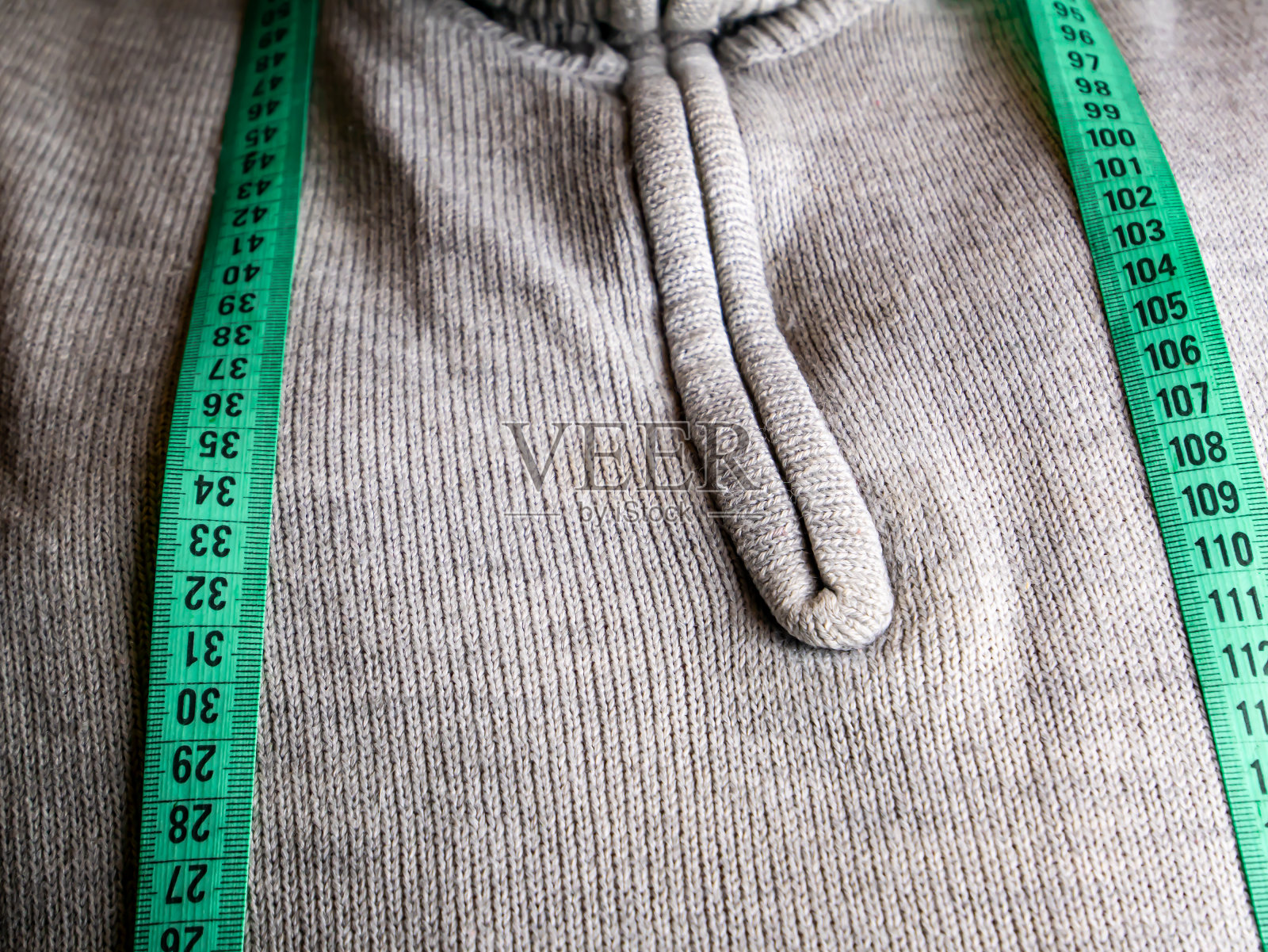 一厘米是裁缝在缝纫时测量的工具。照片摄影图片