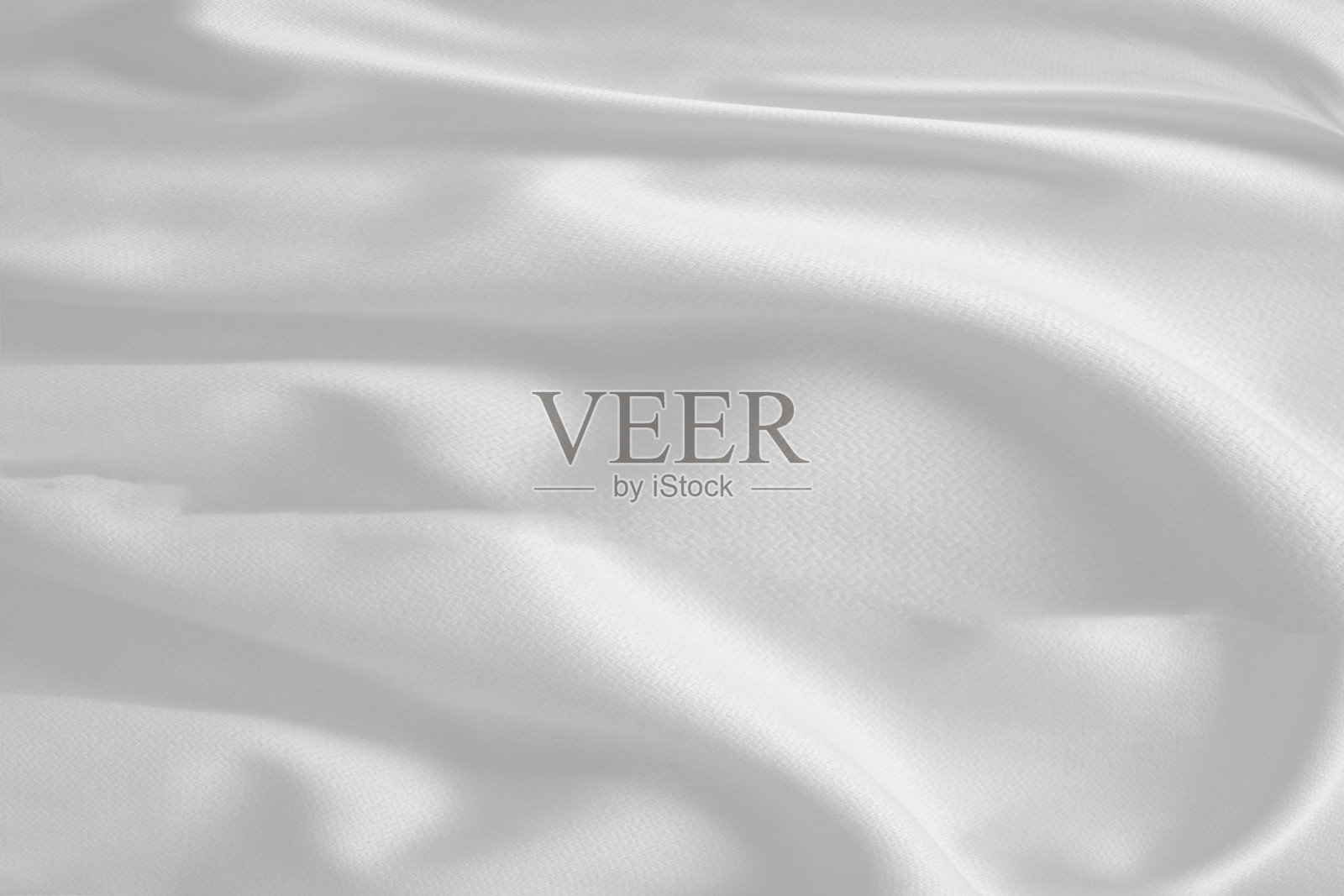 白色缎纹面料,抽象的背景豪华白布。照片摄影图片