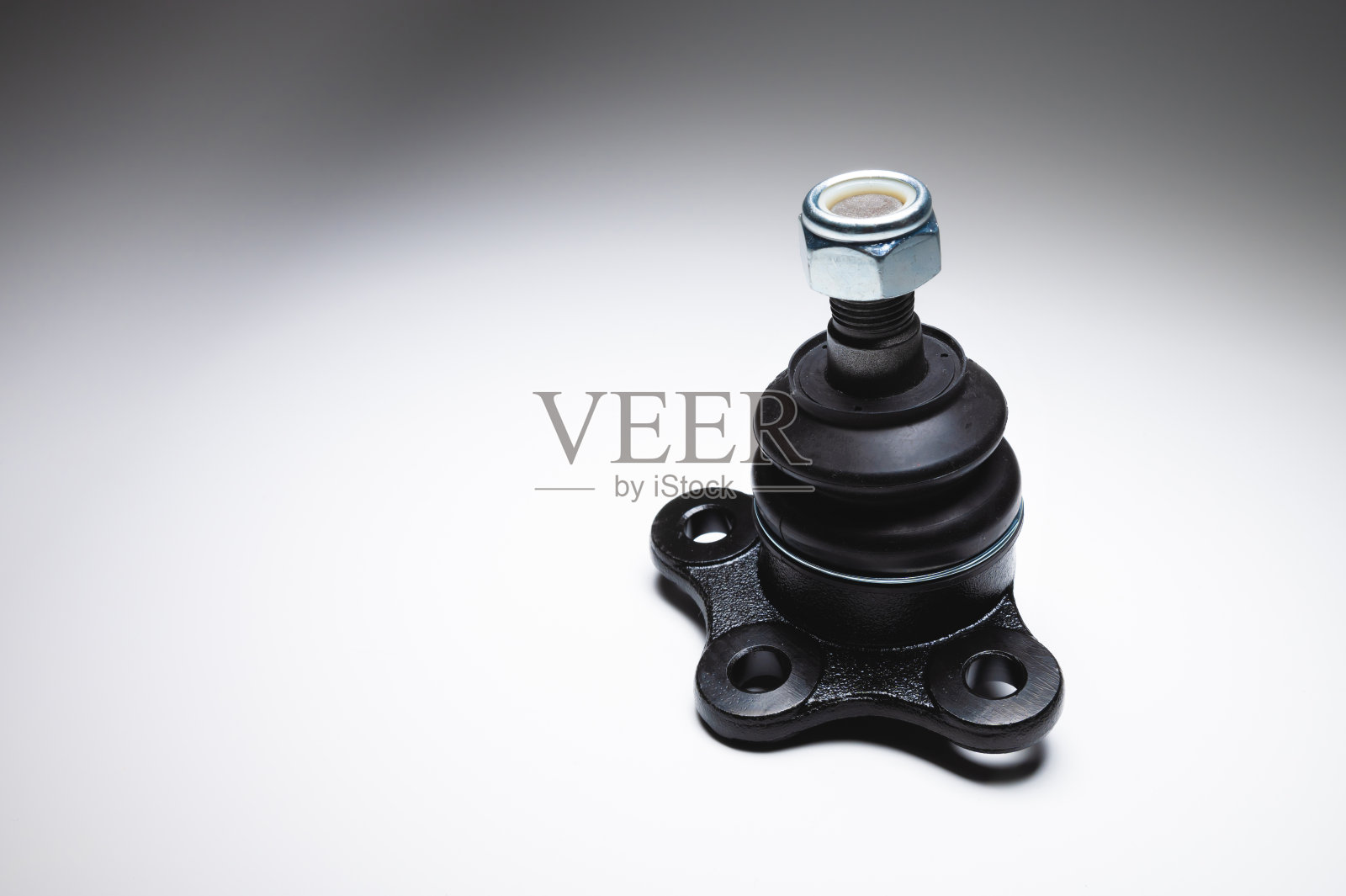 灰色背景下一辆客车的新球接头。备件照片摄影图片