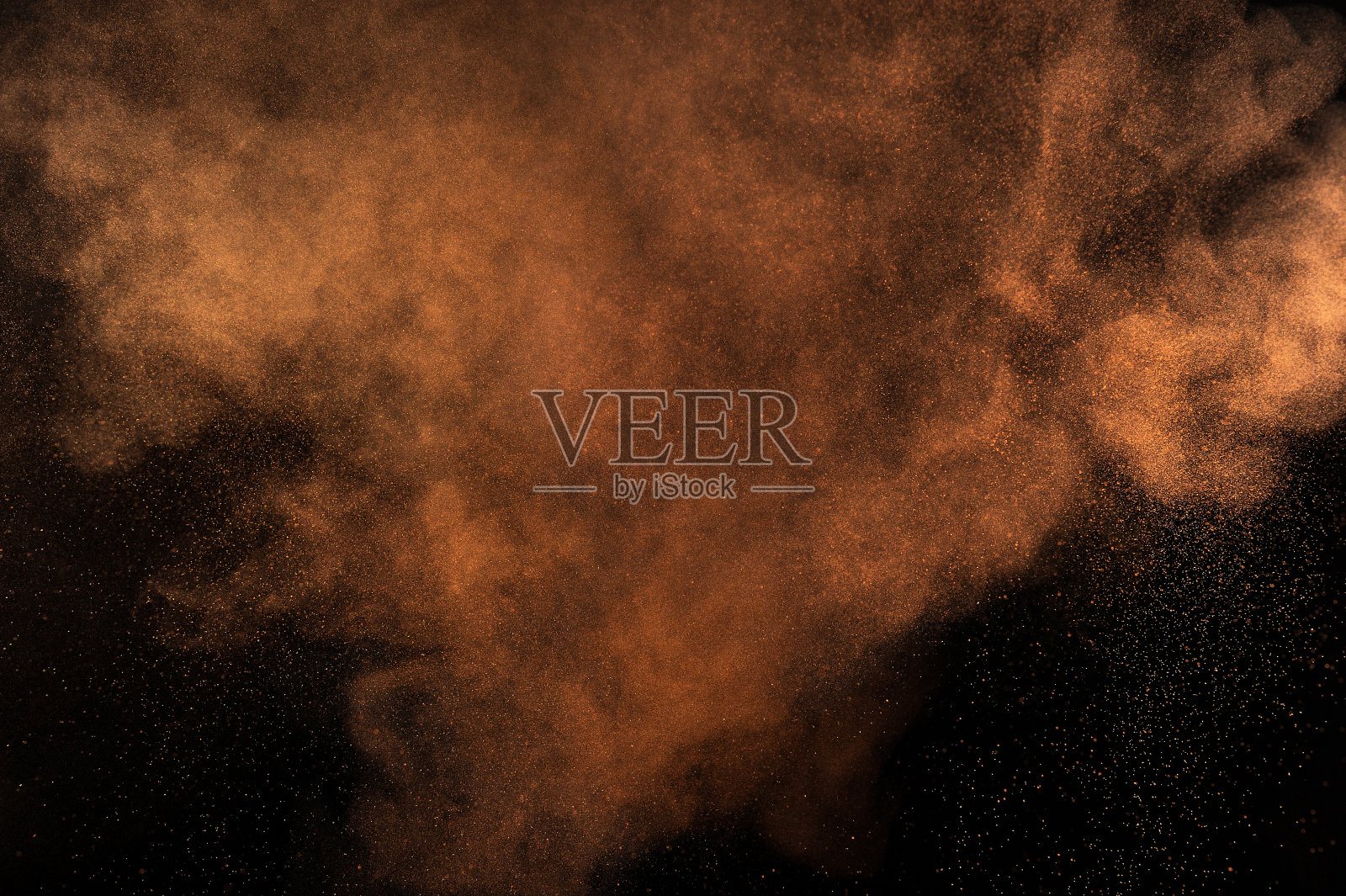 橙色粉末爆炸。照片摄影图片