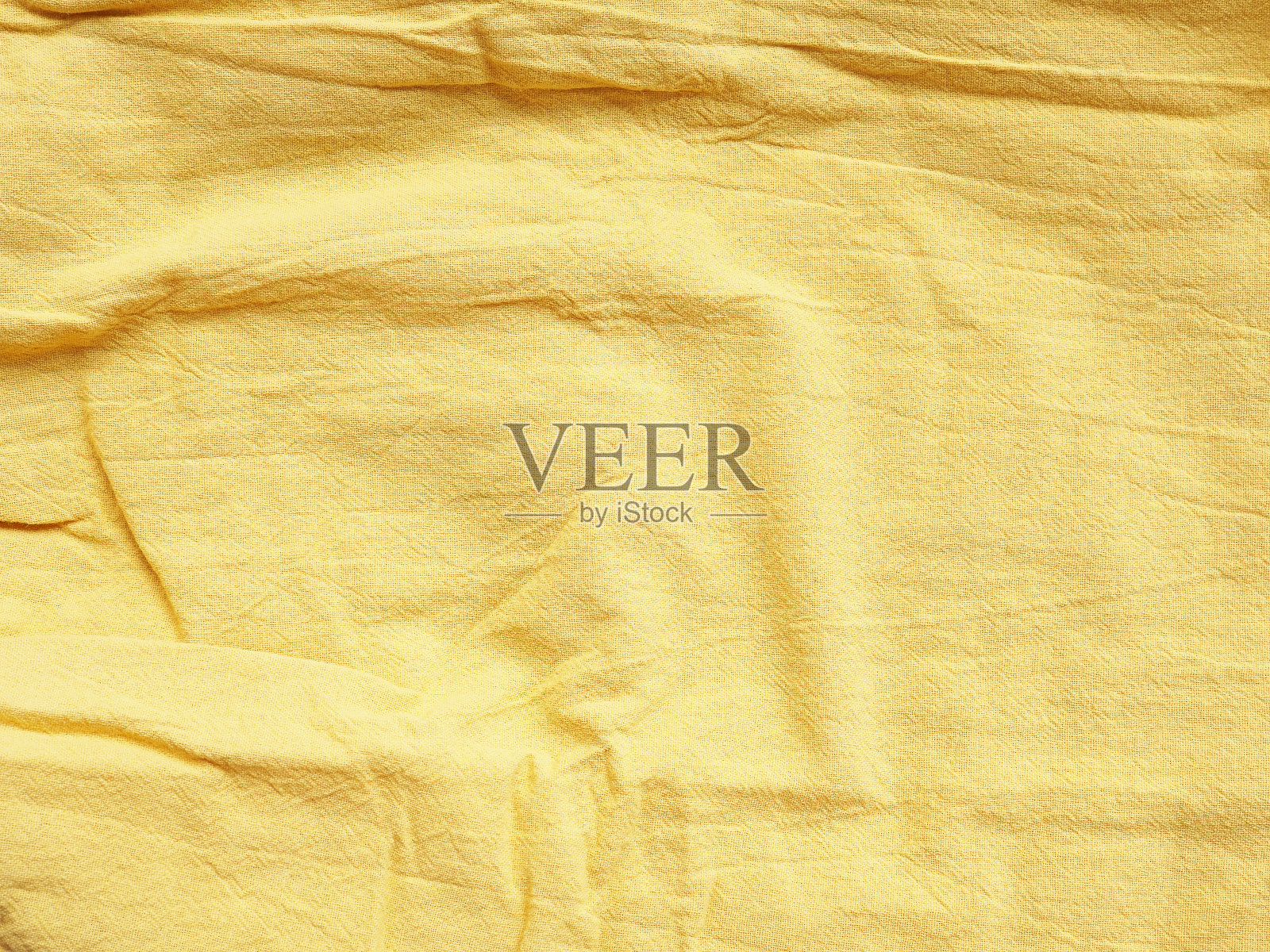 织物的背景纹理为棉麻黄色。为你的文本和设计复制空间。照片摄影图片