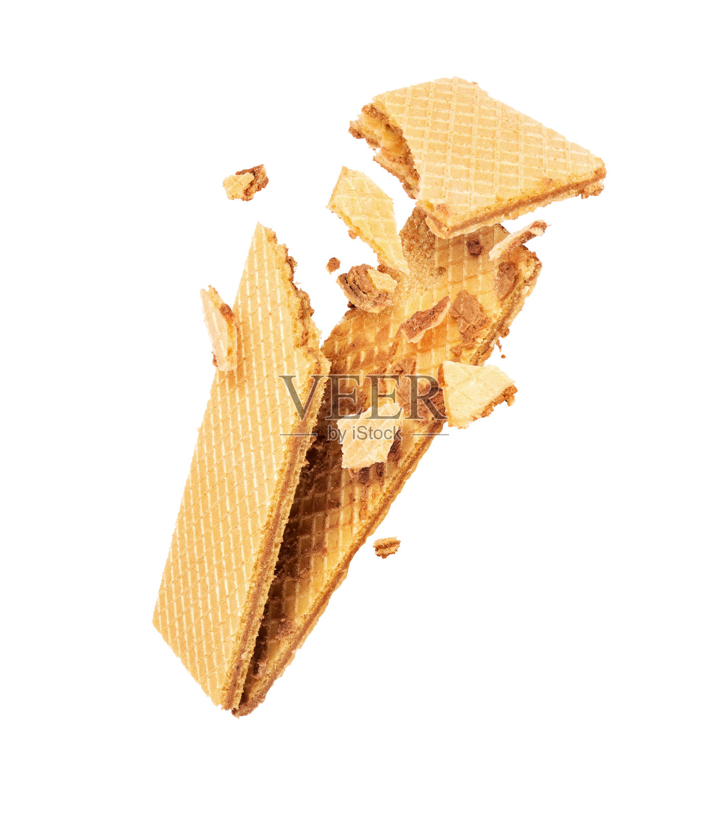 脆皮华夫饼在空中碎成碎片,孤立在白色的背景上照片摄影图片