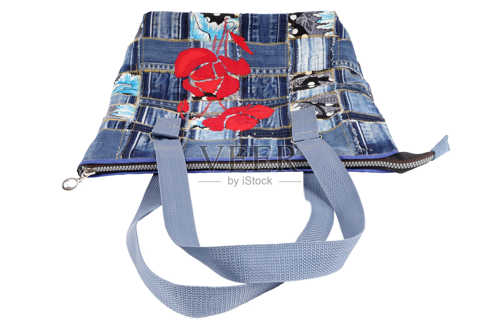 女性手工包的牛仔与花卉图案,孤立的白色照片摄影图片