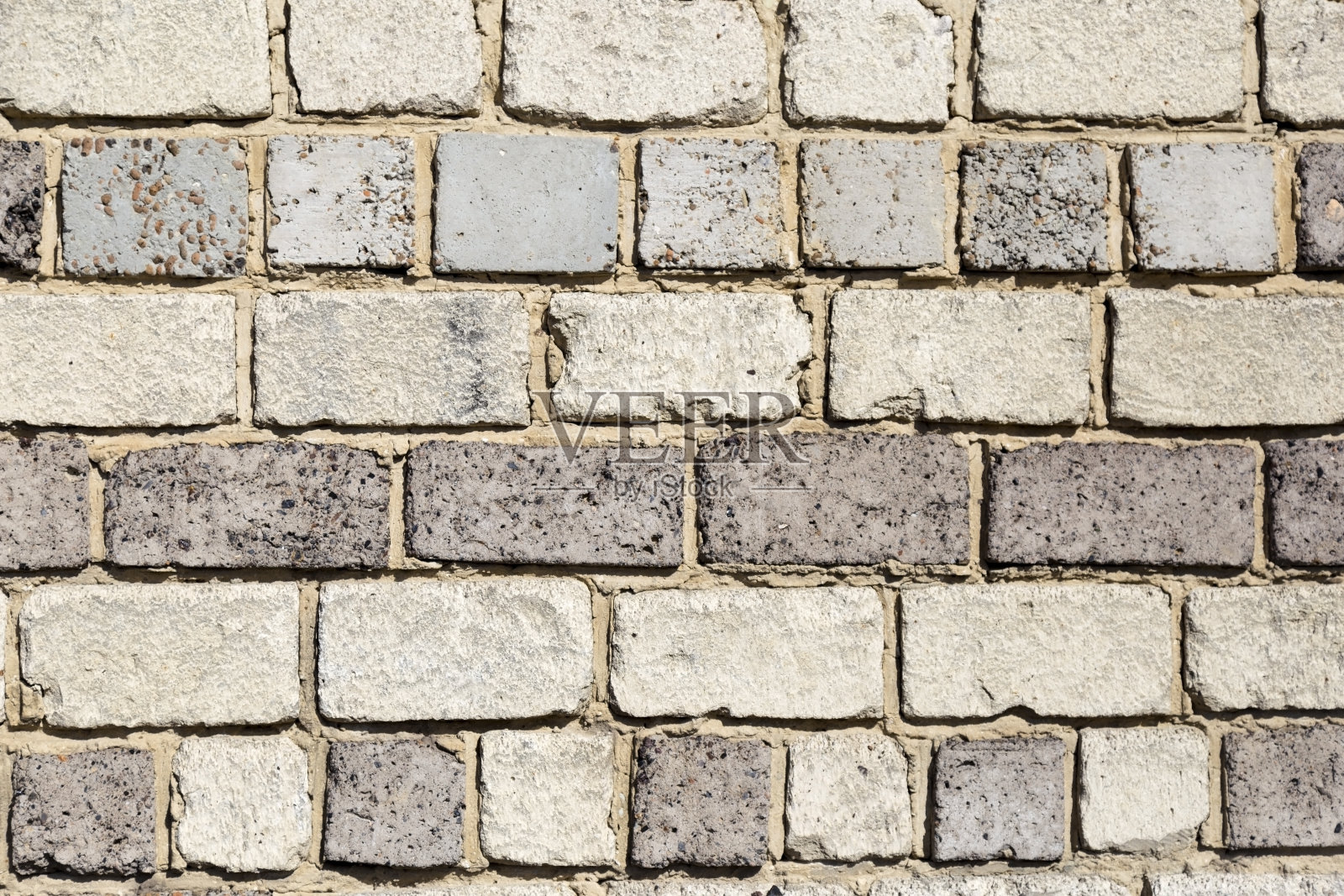 墙由不同质地的石材和大理石块制成照片摄影图片