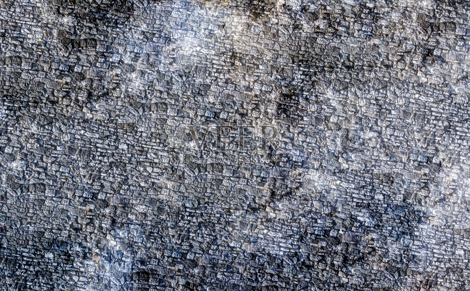 石材背景的老裸和风化的鹅卵石石头老广场照片摄影图片