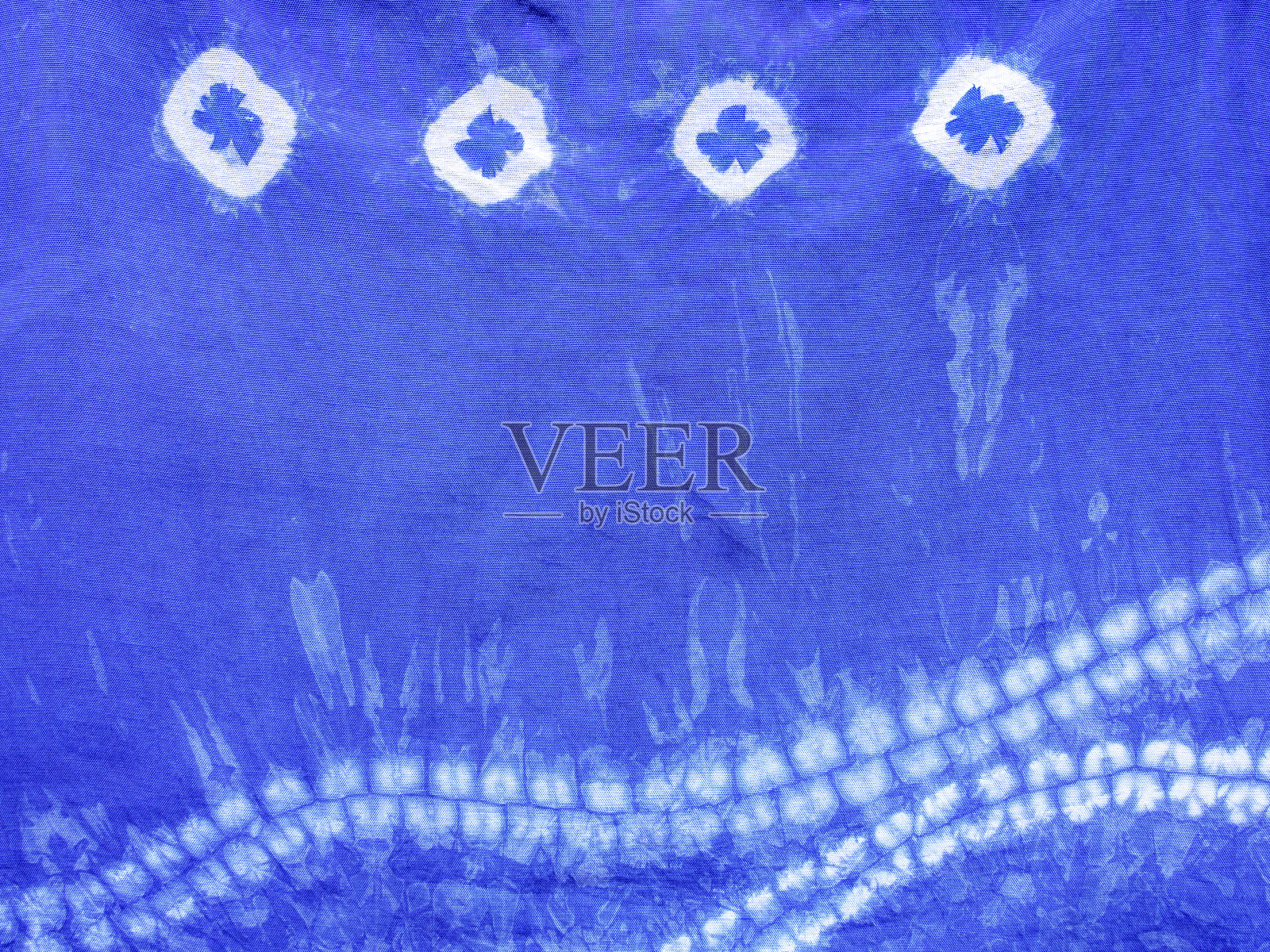 靛蓝色织物扎染图案背景。照片摄影图片