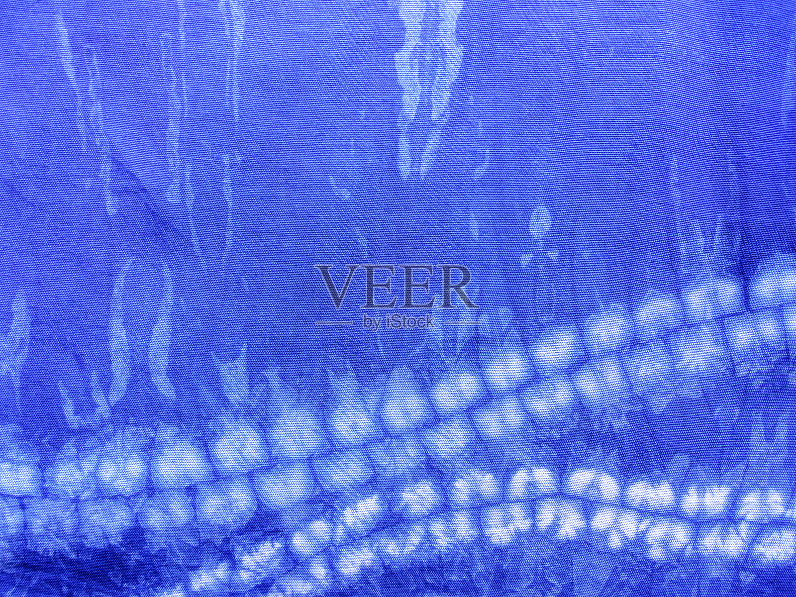 靛蓝色织物扎染图案背景。照片摄影图片