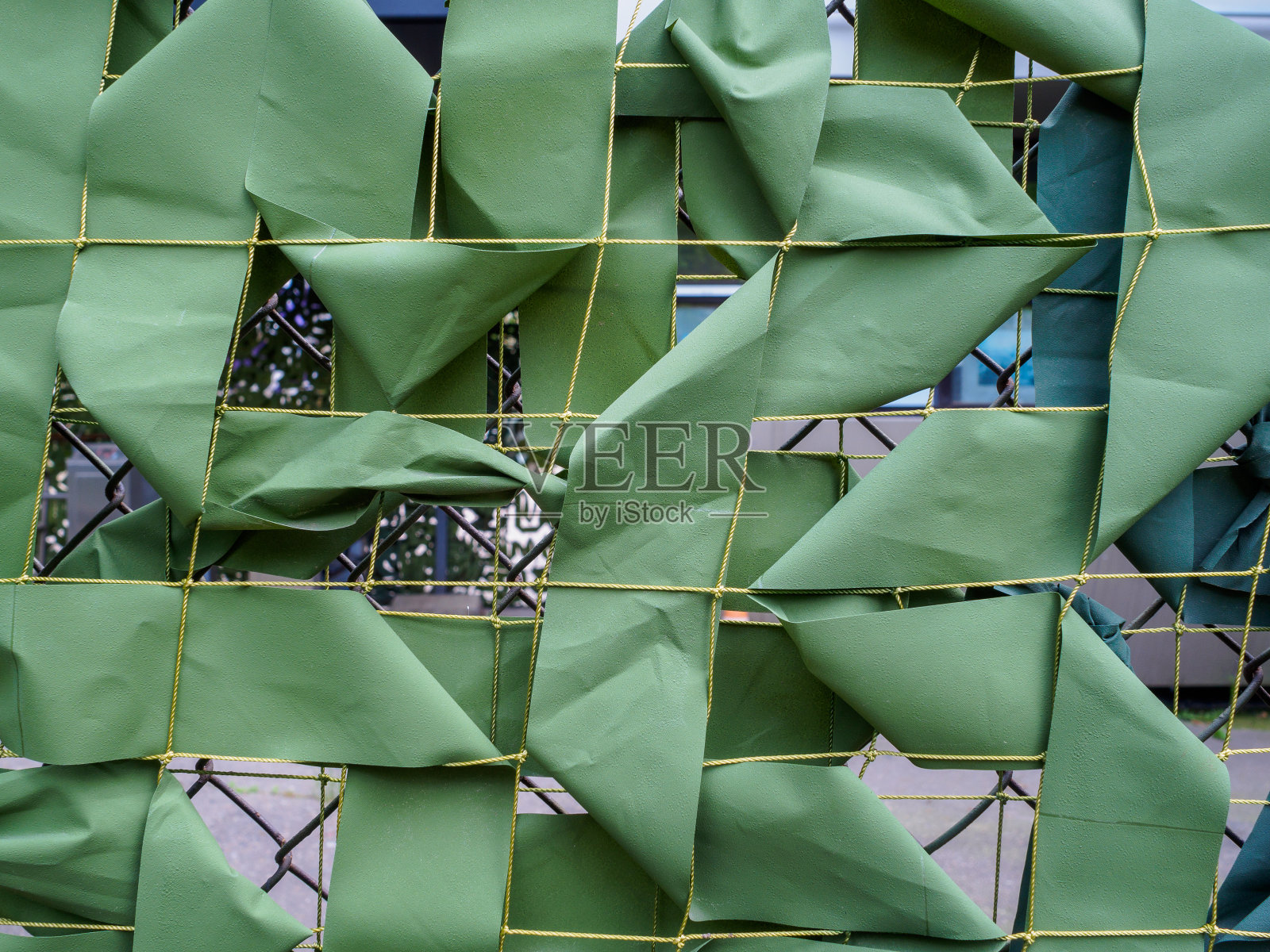 绿色伪装网特写。照片摄影图片