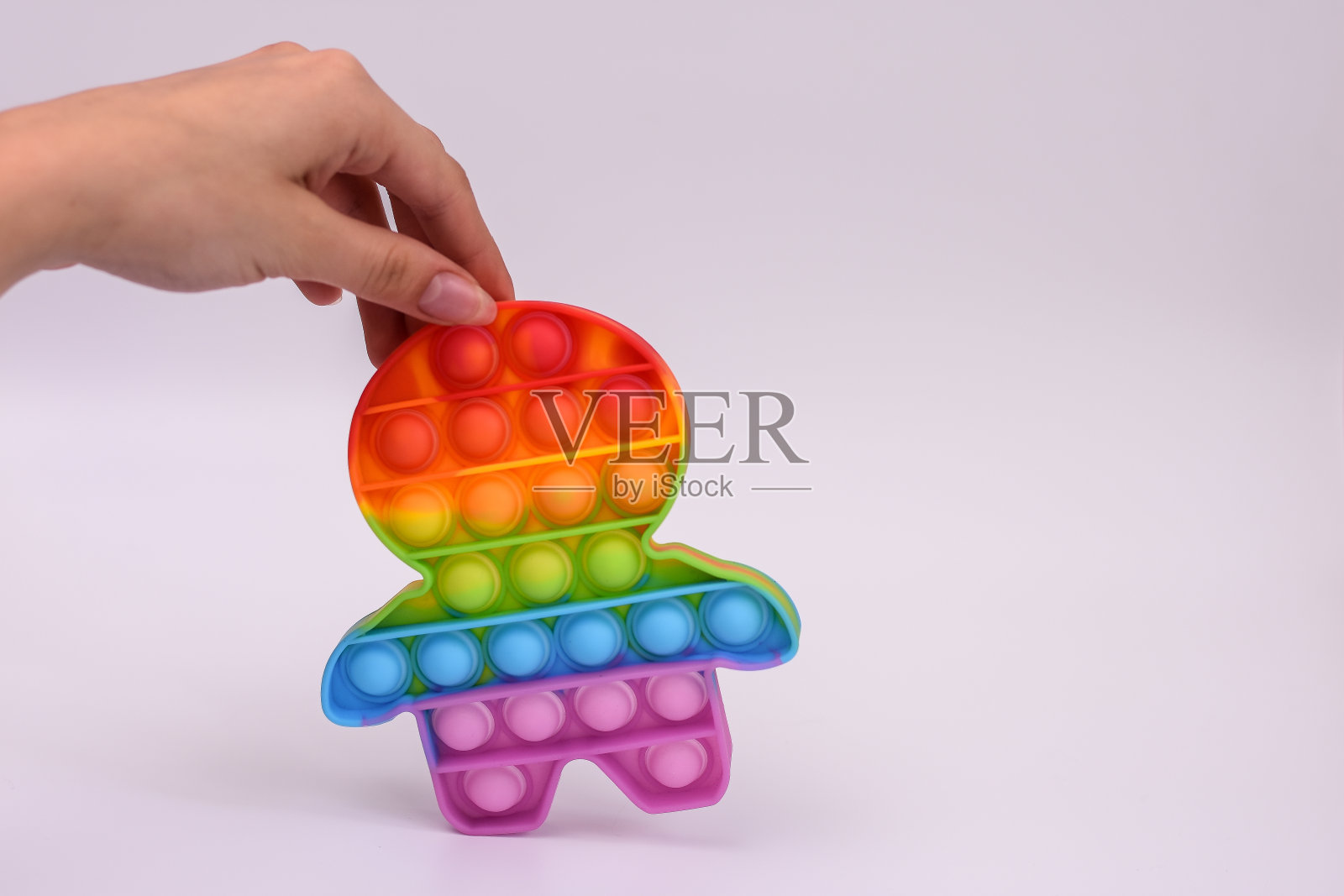 把彩色硅胶玩具做成男人的形状照片摄影图片