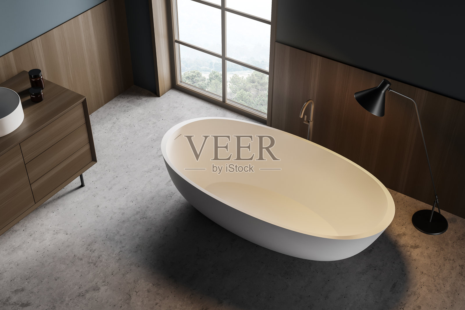 浴室内部有水槽和浴缸,灰色地板上有灯,俯视图照片摄影图片