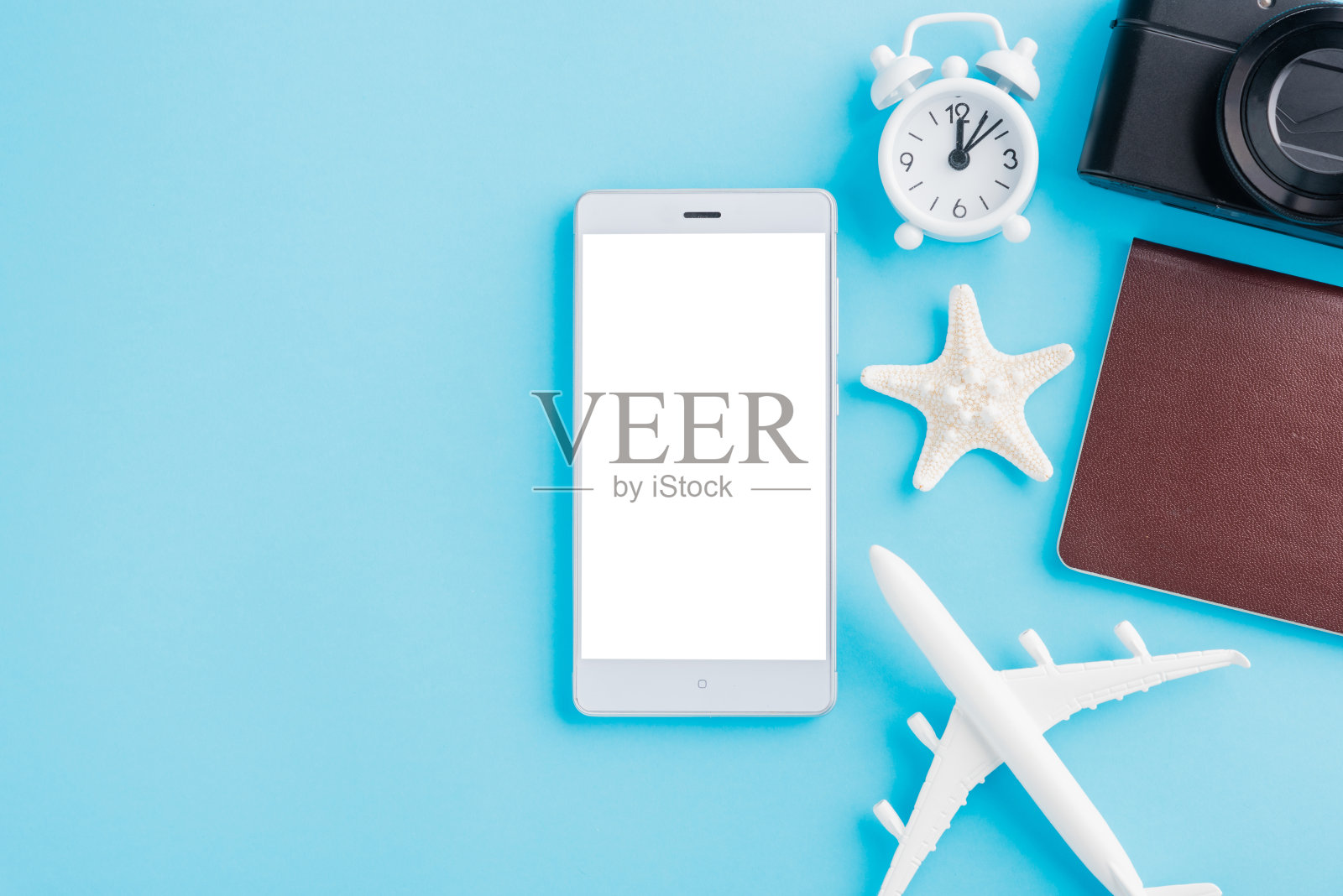 模型飞机,飞机,海星,闹钟,指南针和智能手机黑屏照片摄影图片