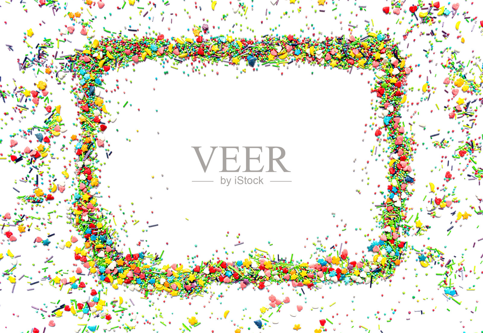 明亮的孤立框架,由多色的甜洒不同形状的心,星星,月亮,花,圆球和棒子照片摄影图片