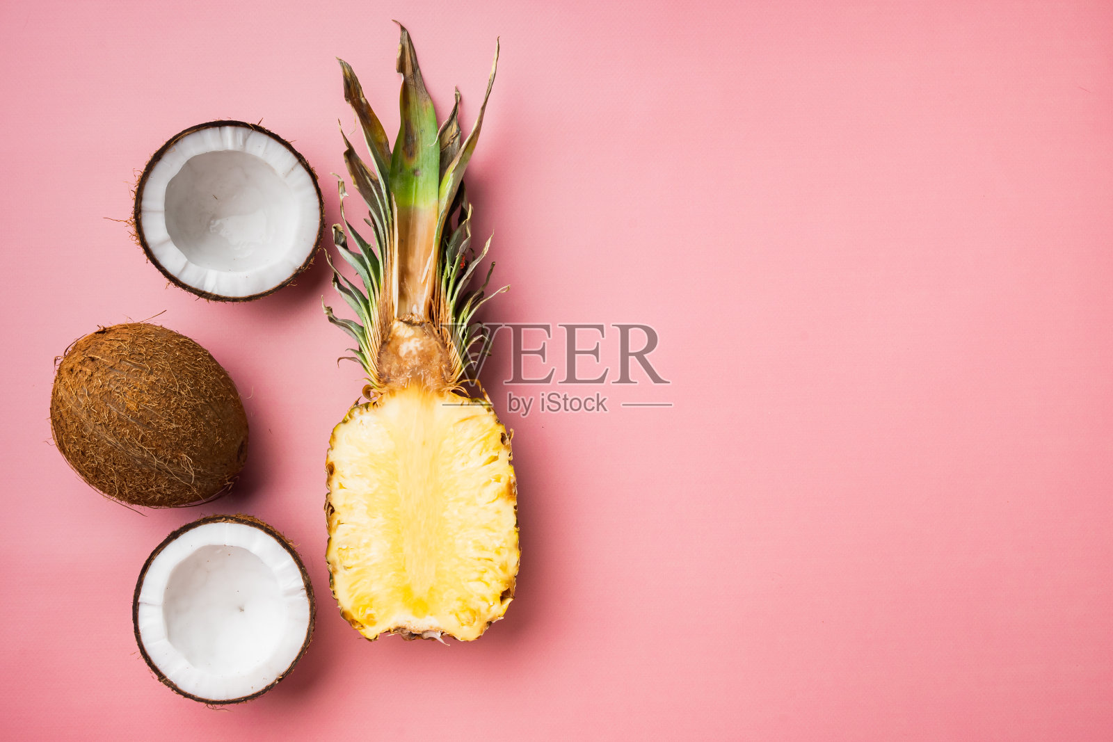 新鲜的异国水果,菠萝和椰子,粉红色纹理的夏季背景,俯视图平lay,与文本复制空间照片摄影图片