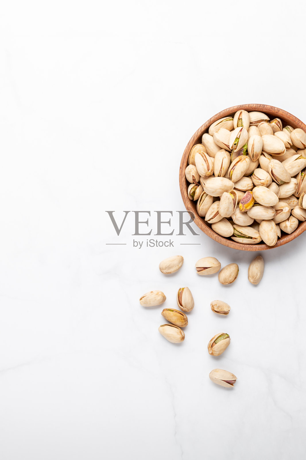 木碗里的开心果照片摄影图片