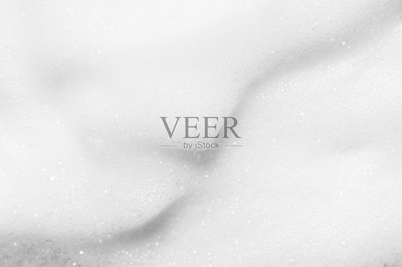 白色柔和泡沫质地的现代洁面化妆品护肤产品作为背景极端近距离观察从上面。照片摄影图片