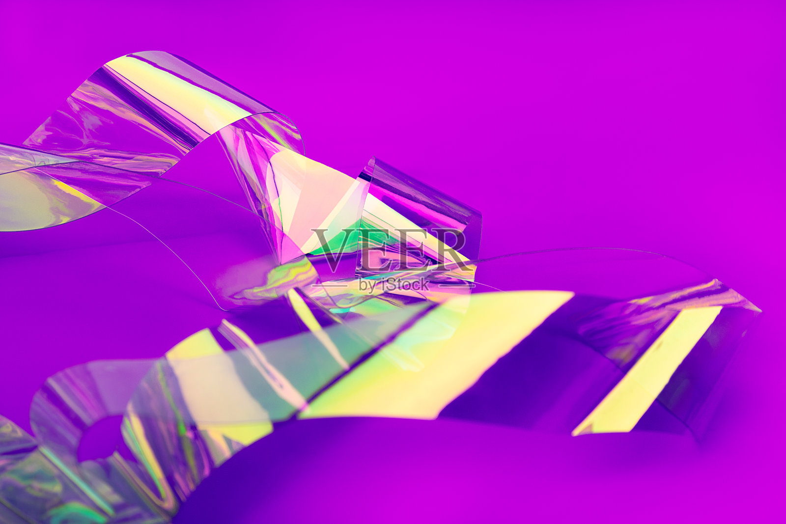 抽象背景全息胶带箔,霓虹色彩。照片摄影图片