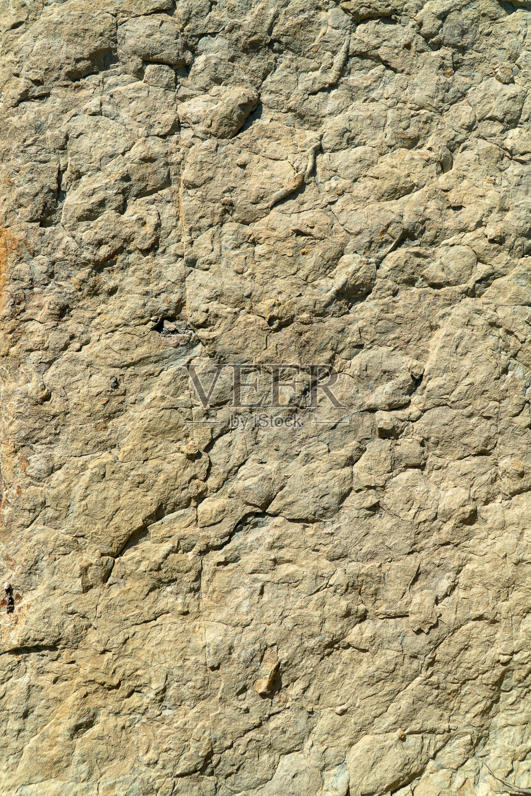 一个灰色岩石凹凸不平的表面的特写照片摄影图片