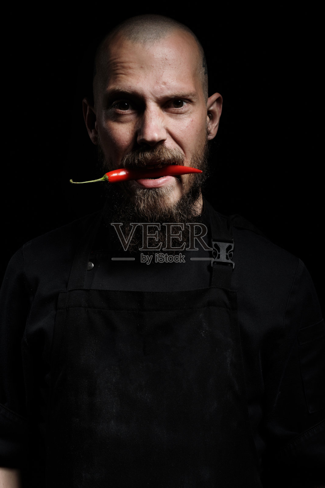 厨师的肖像辛辣的红辣椒照片摄影图片