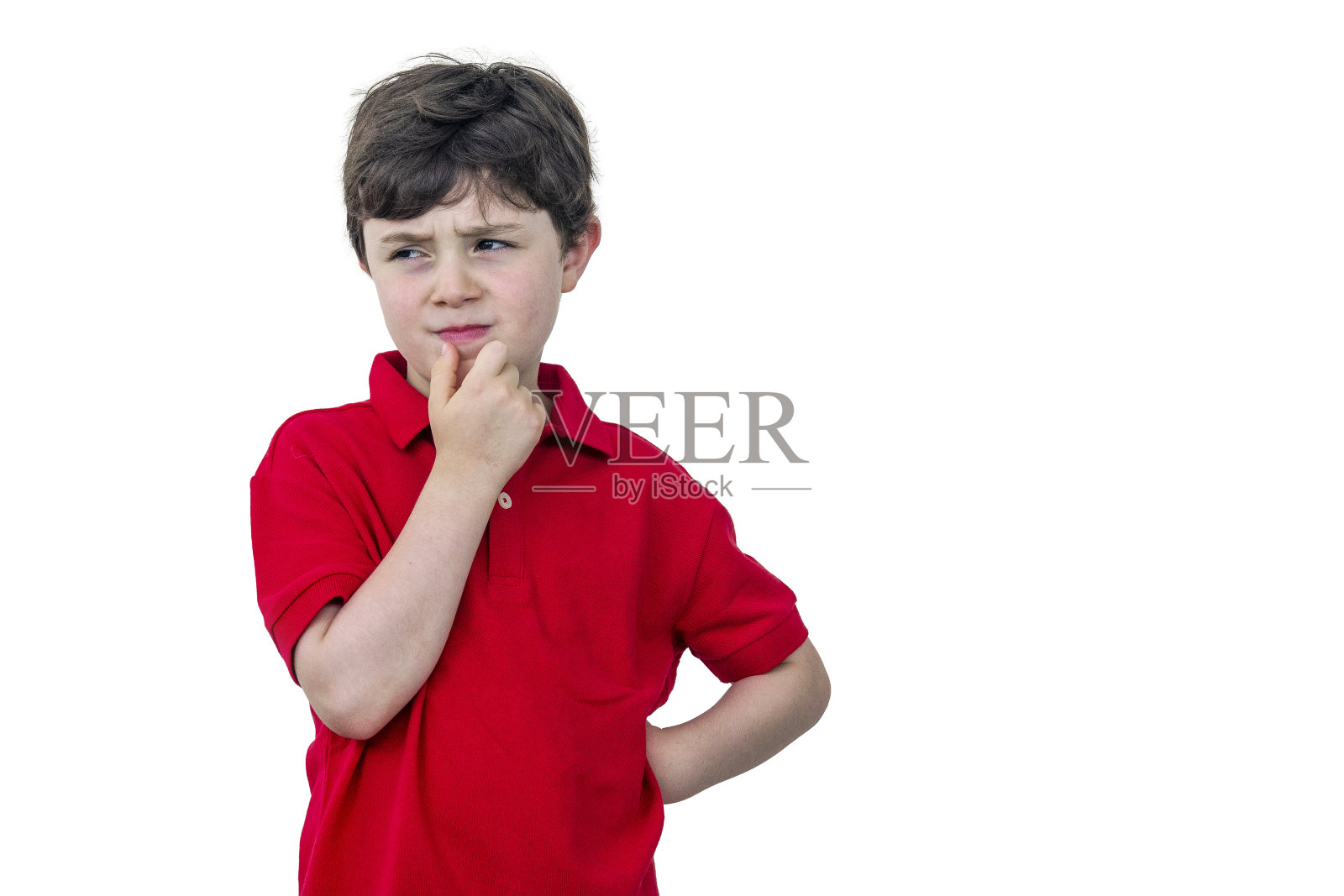 可疑的七岁男孩照片摄影图片