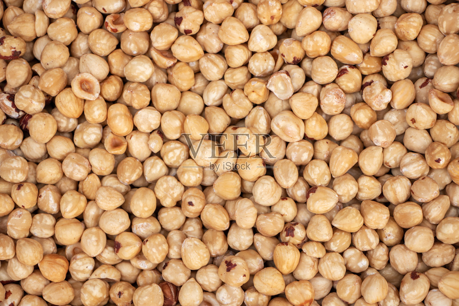 榛子的背景。一堆去皮榛子。照片摄影图片