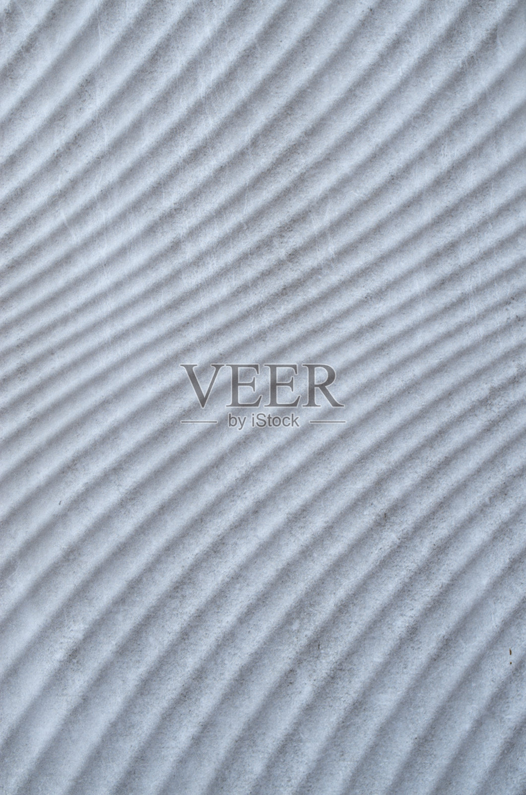 许多平行压花白色曲线在平板上关闭照片摄影图片