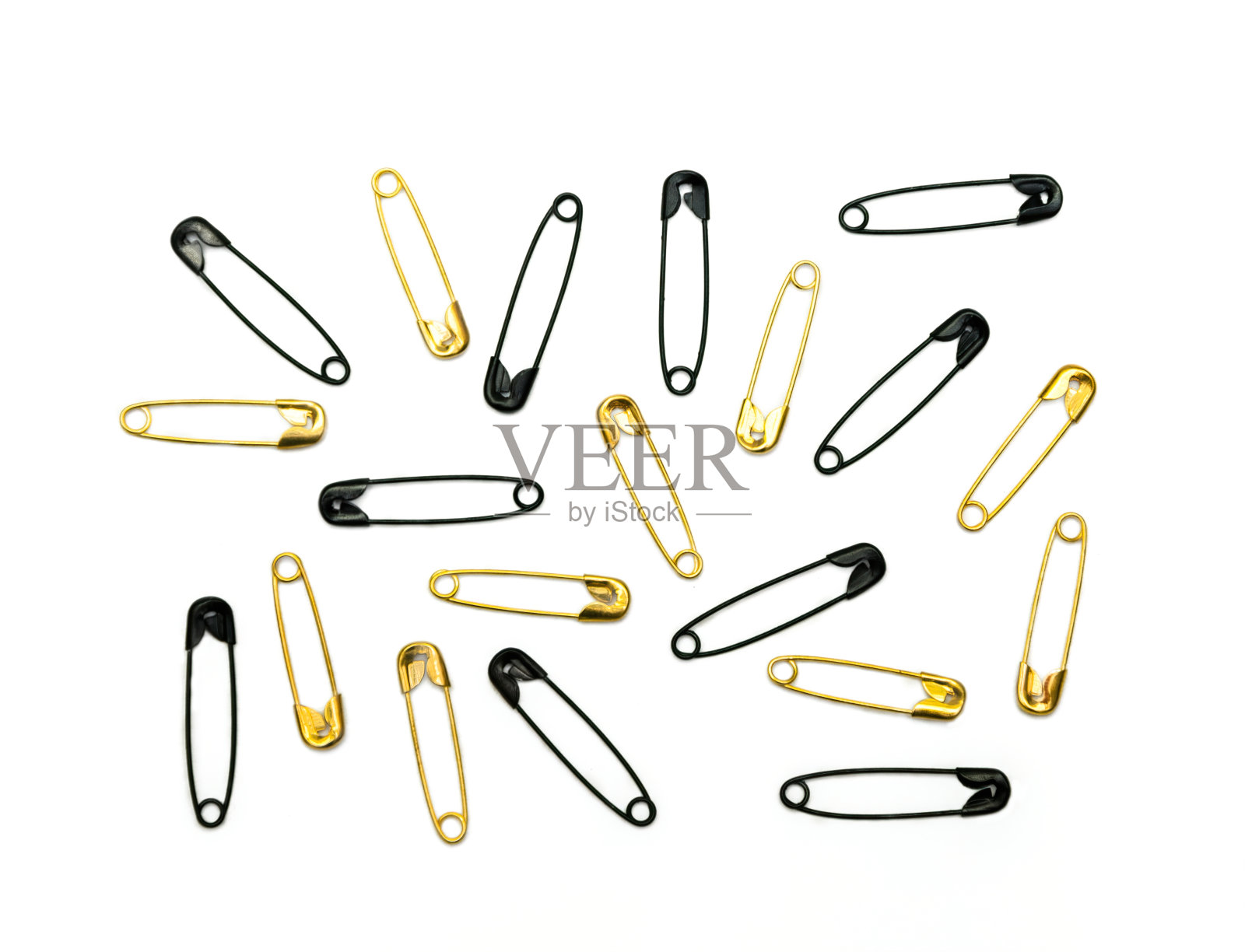 套金色和黑色的英国安全别针照片摄影图片