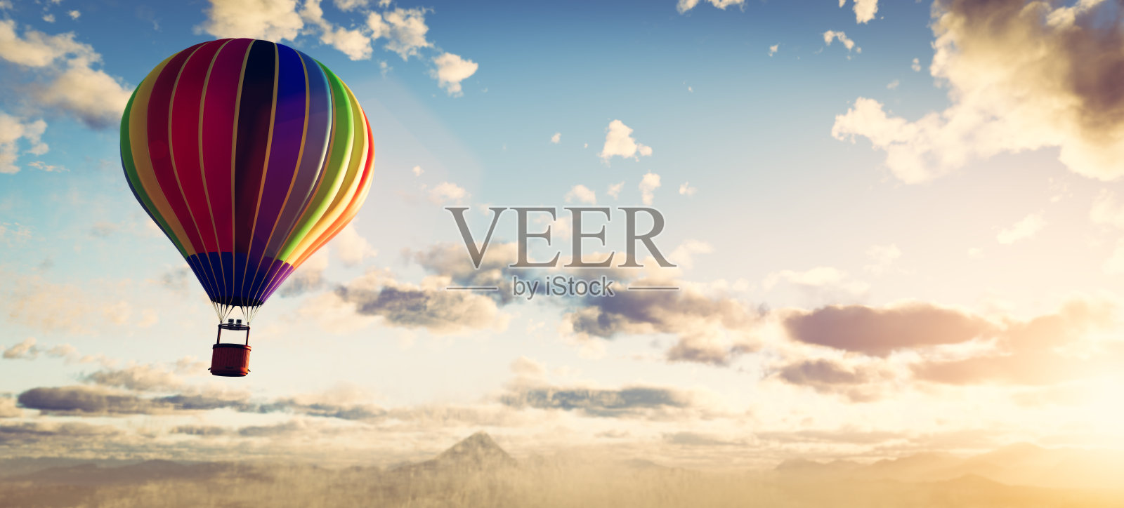 日落时在云层上飞行的热气球照片摄影图片