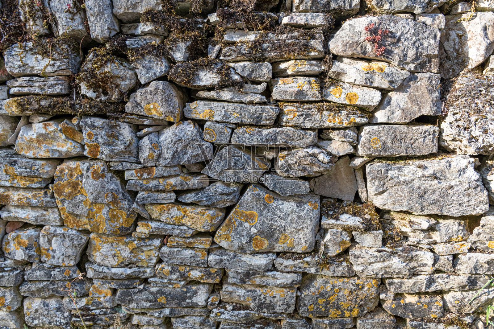 用于背景或纹理的旧石墙照片摄影图片