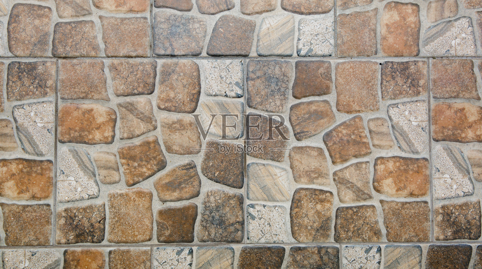 石砖模式。陶瓷完成。褐灰色背景。地板的装饰材料。仿大理石。内外装饰。复古风格。几何正方形。自然的设计照片摄影图片