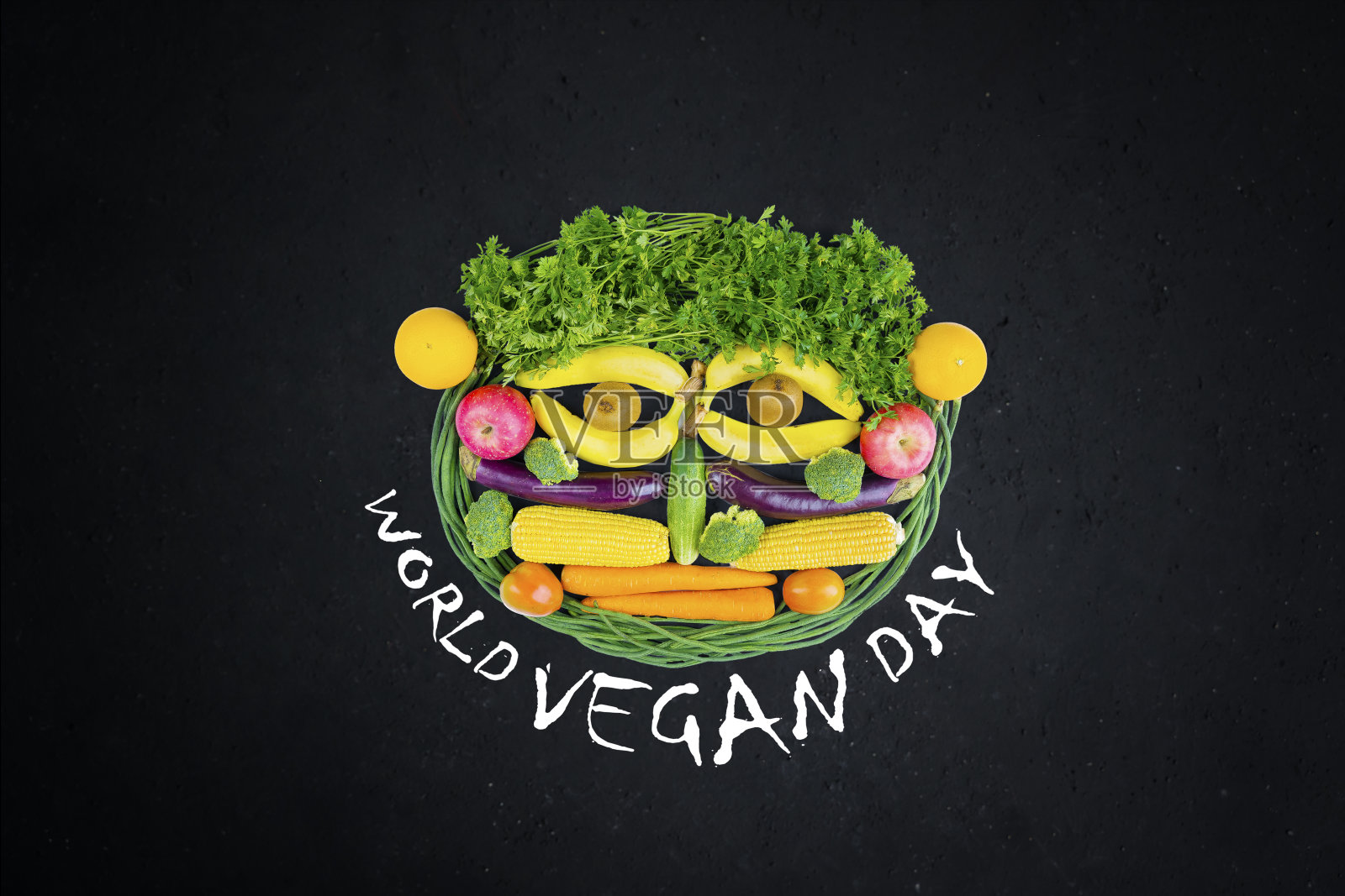 蔬菜用世界素食日的文字塑造了一张脸照片摄影图片