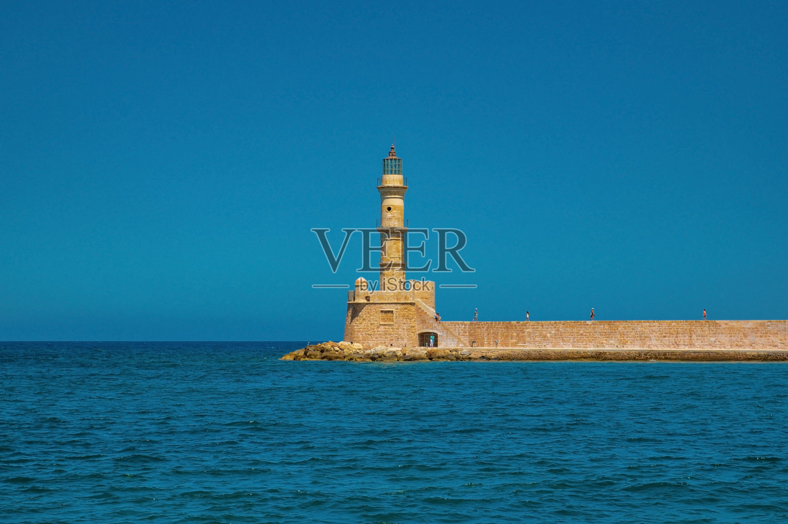 一个美丽的灯塔,作为最著名的景点之一,坐落在古老的威尼斯港口的入口处。照片摄影图片