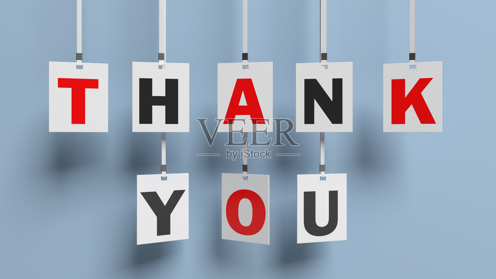 悬挂在白色纸上的感谢短信。照片摄影图片