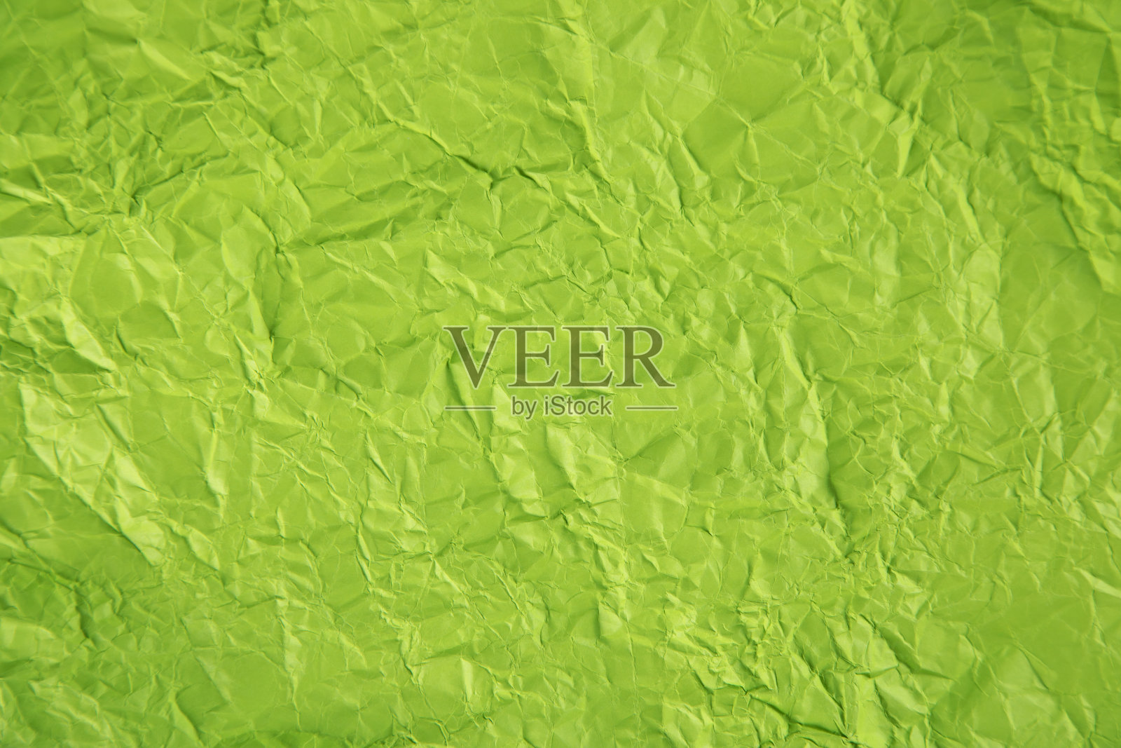 绿色皱巴巴的背景或纹理。照片摄影图片